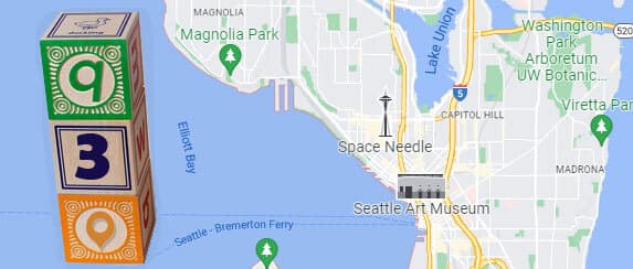 Introductory image of building blocks with the letter Q and the number 3 on a map of Seattle.