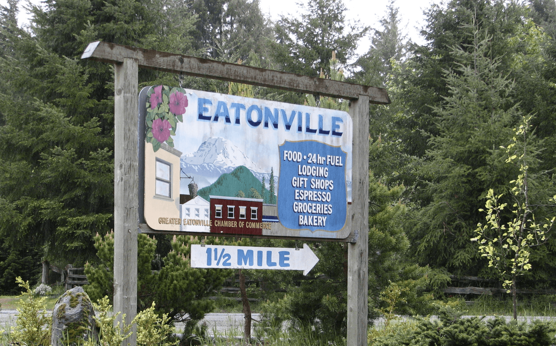 town welcome sign highlights available local businesses