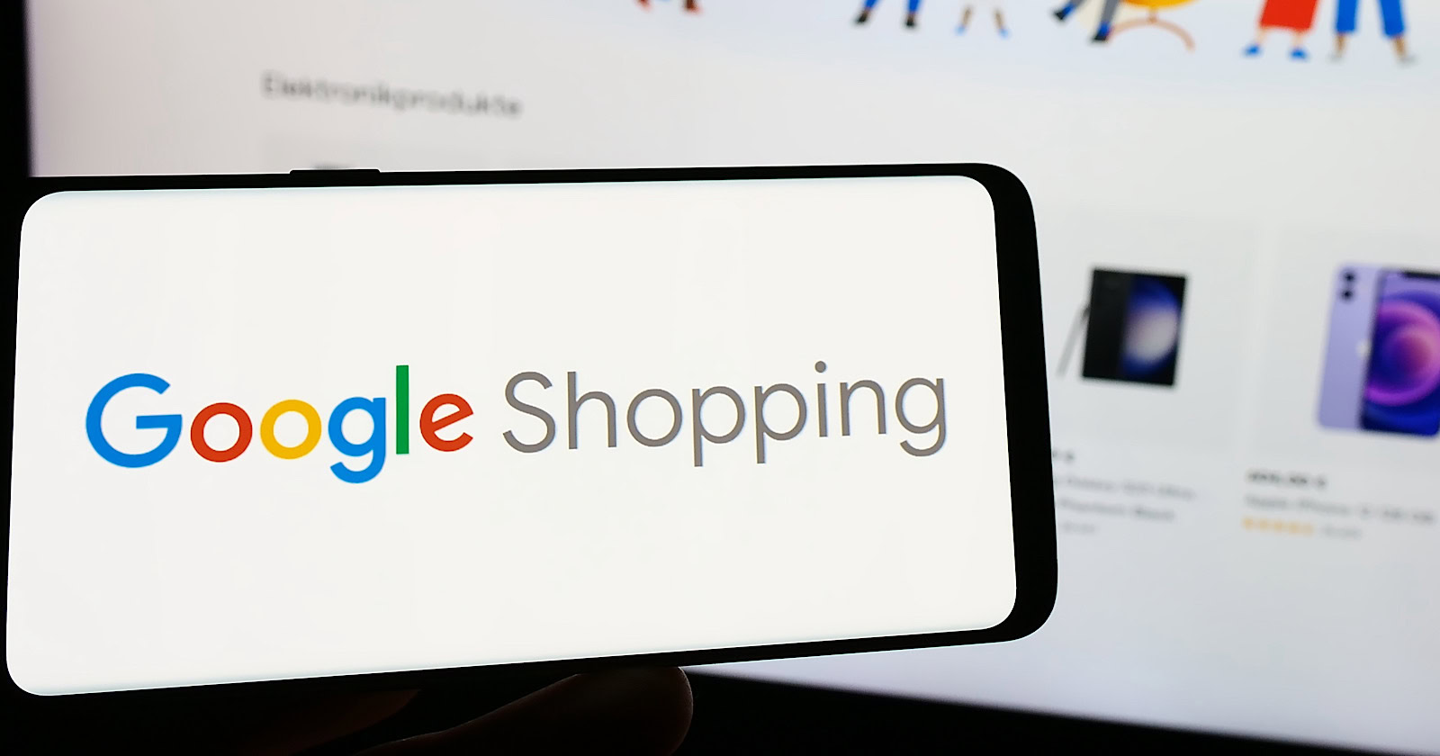 Person holding smartphone with logo of product search platform Google Shopping on screen in front of website.