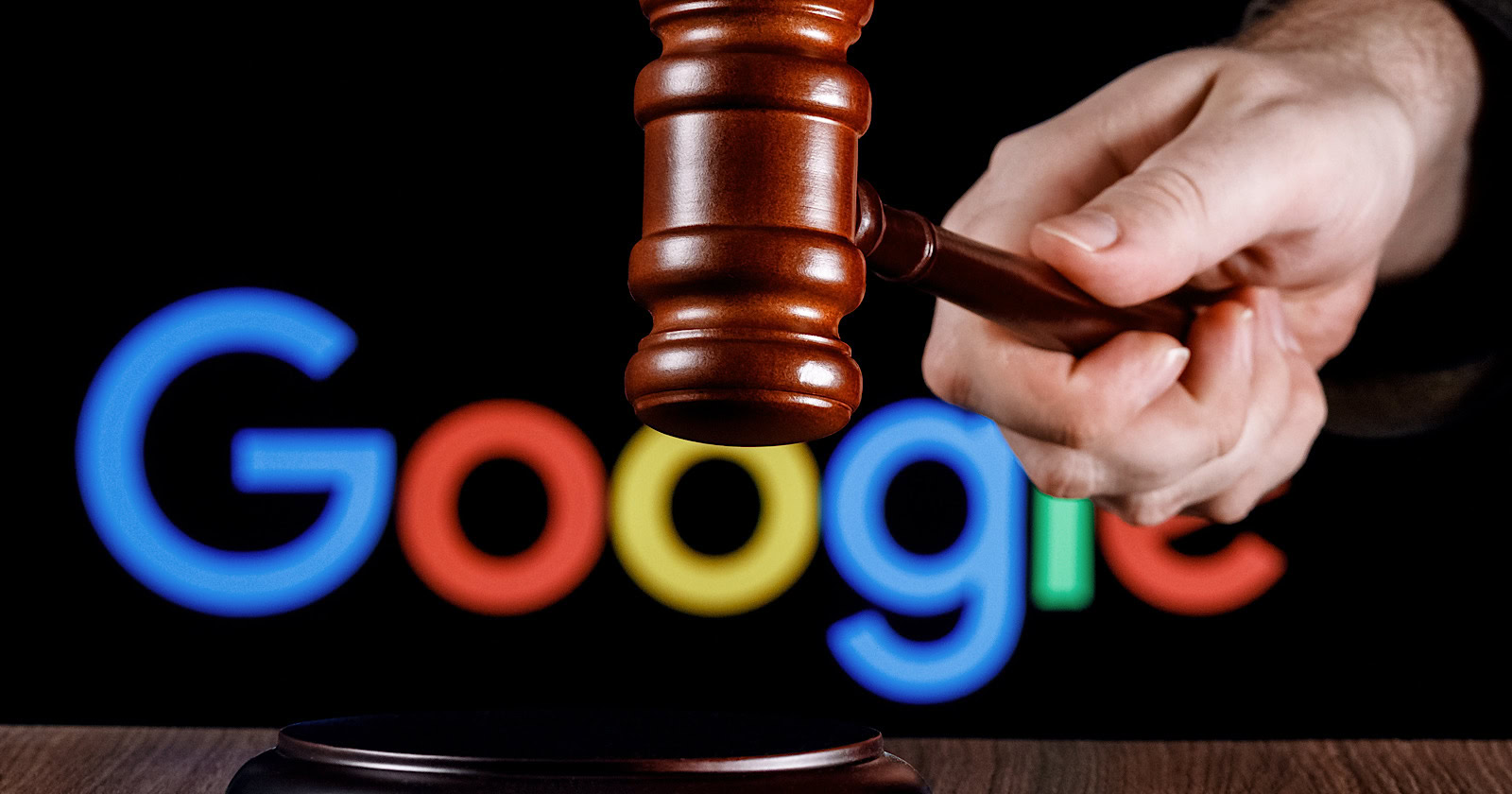 Gavel in hand against the background of Google logo.